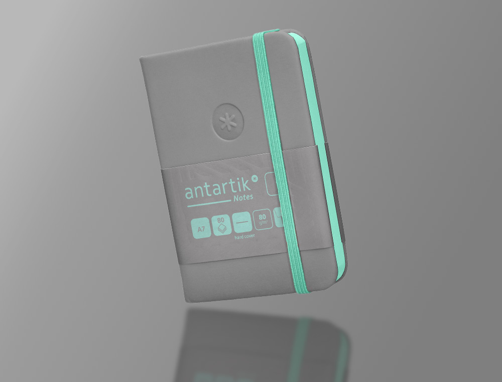 CADERNO COM ELASTICO ANTARTIK NOTES CAPA DURA A7 LISO CINZA E TURQUESA 80 FOLHAS 80 GR FSC